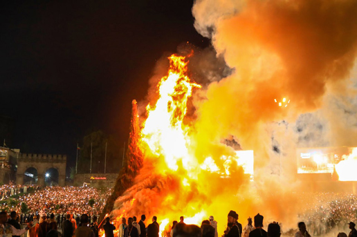Massive Meskel Demera bonfire burning at night as crowds gather to celebrate Ethiopia’s vibrant tradition.